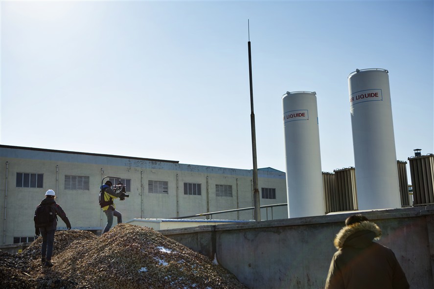 Beijing production crew coordinating a shoot in an industrial location